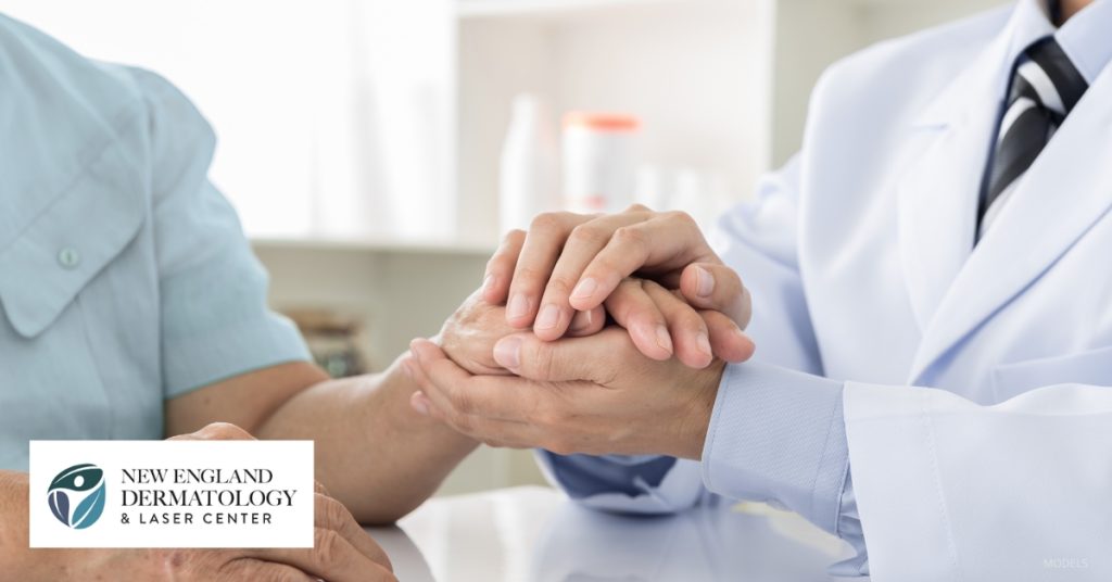 a doctor is holding a patient's hand (MODELS)